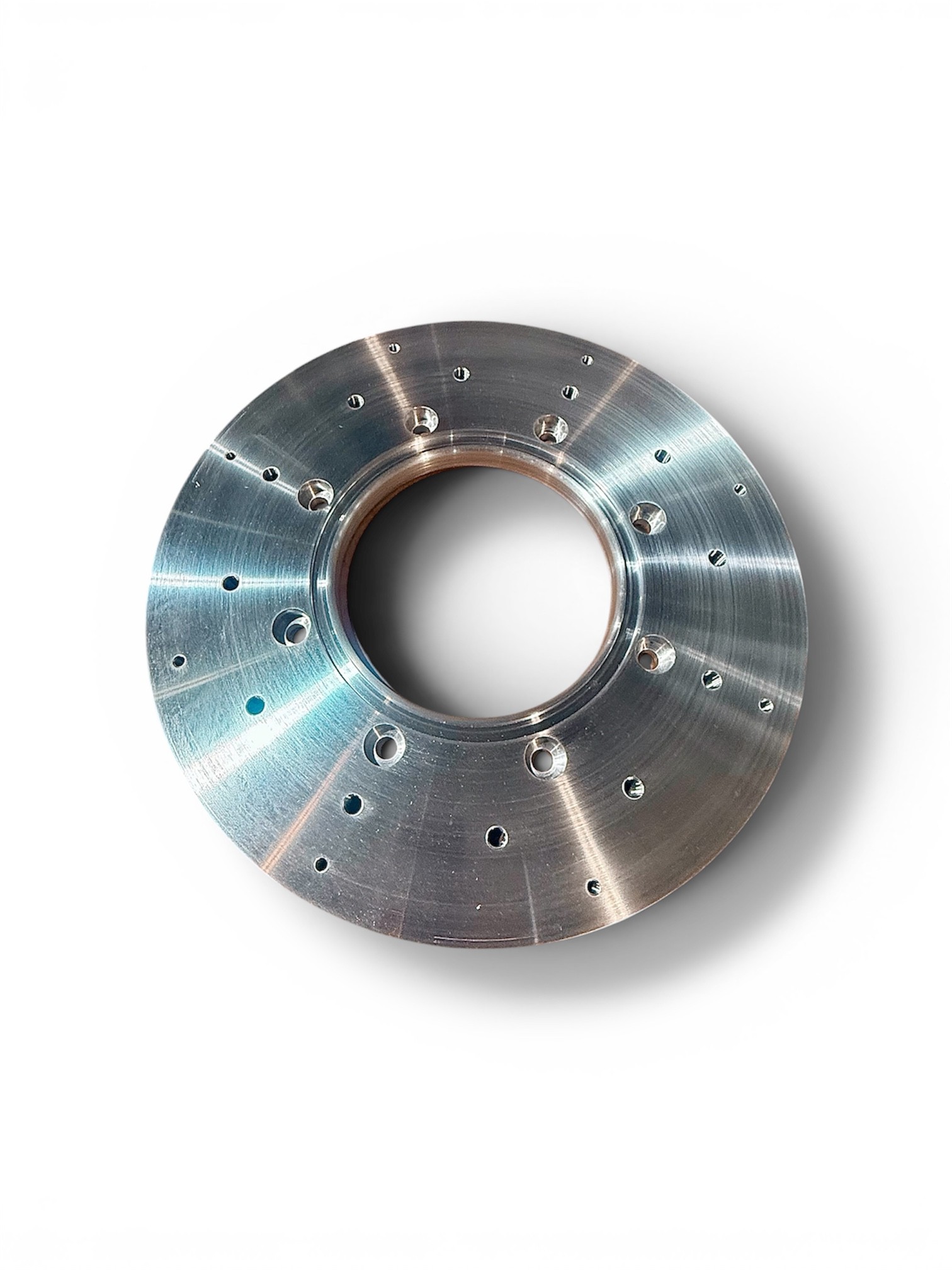 Finished machined disc with drilled pattern