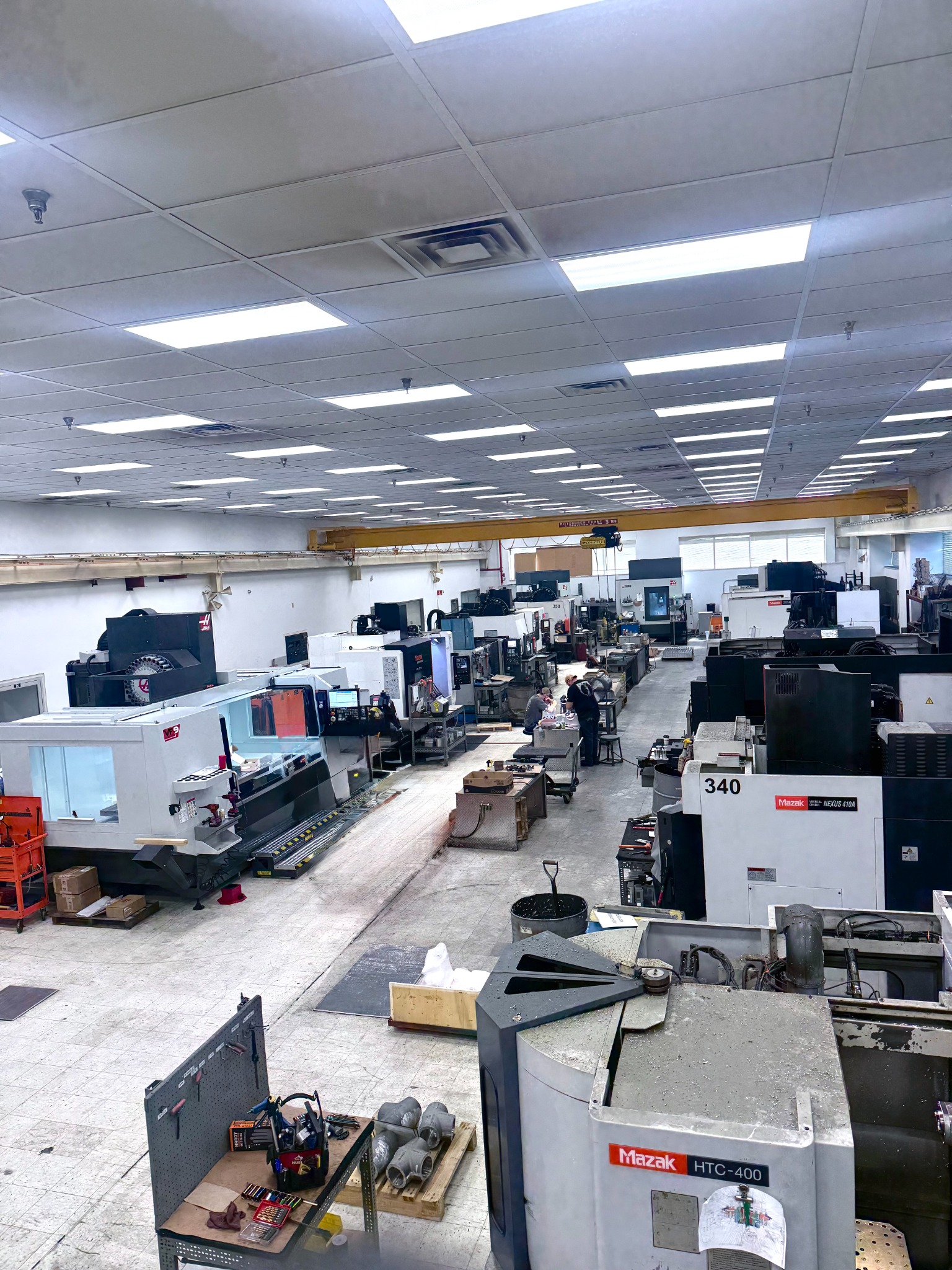 Wide view of Quality Mould manufacturing floor and equipment