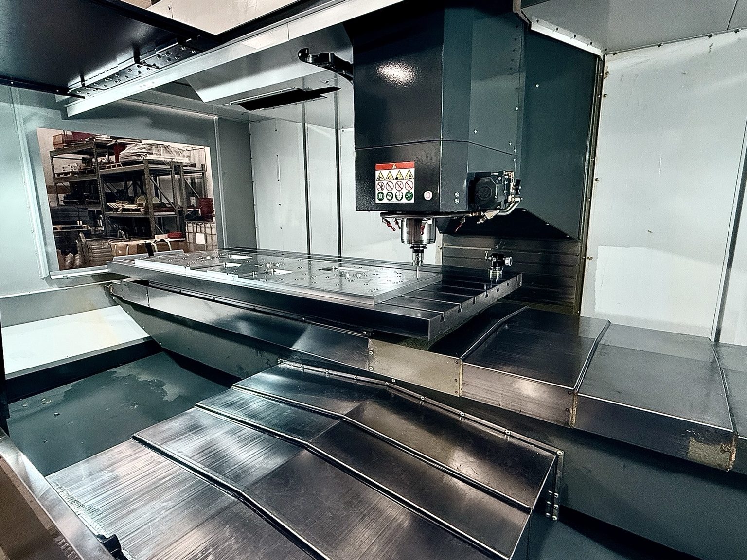 Large CNC machining center set up with a long precision machined plate